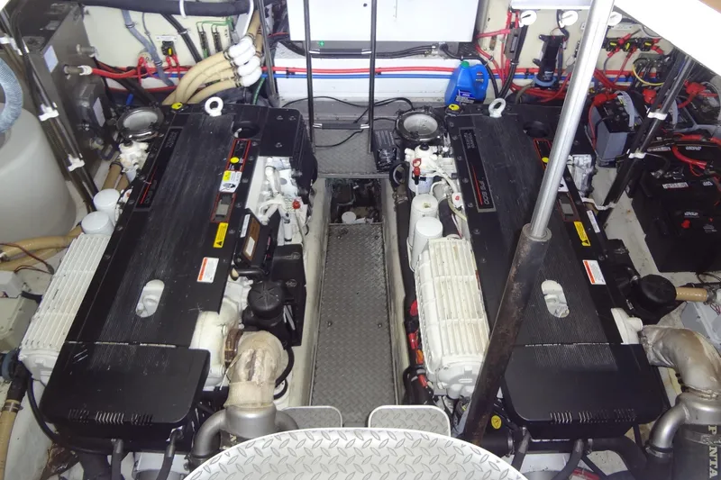 Slide: The Image of Engine room of a 2010 Formula 45 Yacht with dual engines and mechanical components. - 73