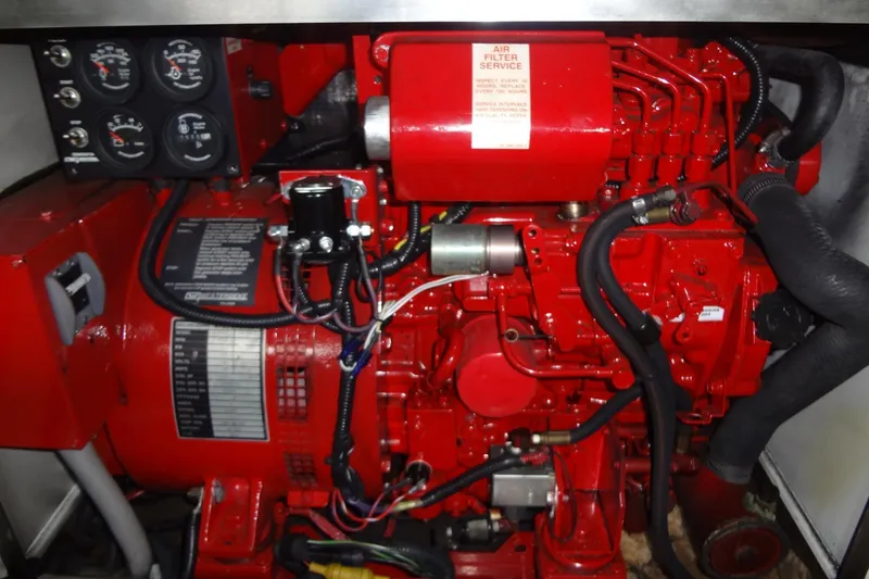 Slide: The Image of Red engine of a 2010 Formula 45 Yacht with gauges and wiring. - 79