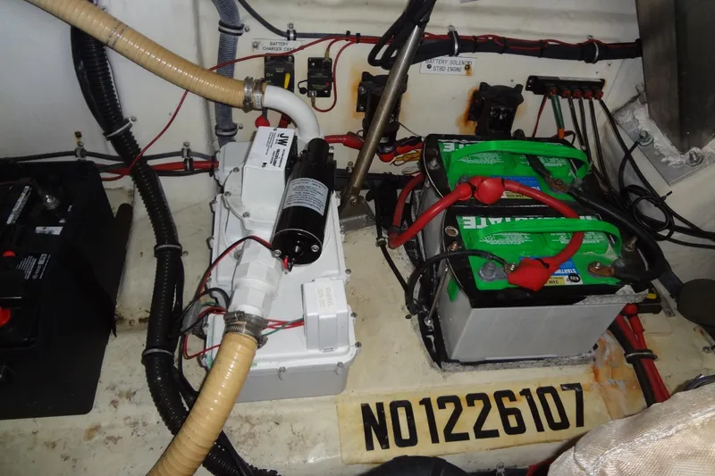 Slide: The Image of Engine compartment of a 2010 Formula 45 Yacht with batteries and wiring. - 82