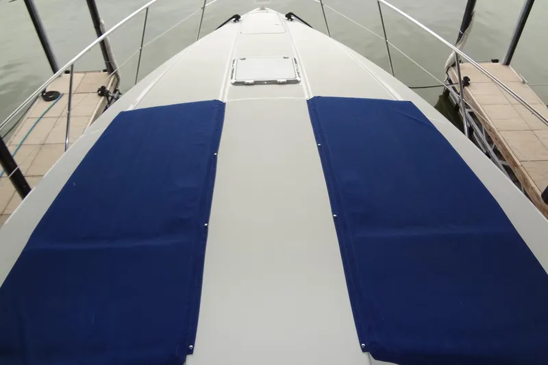 Slide: The Image of 2010 Formula 45 Yacht cruising on a sunny lake with clear blue skies. - 9