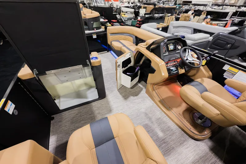 Slide: The Image of 2026 Godfrey Monaco 235 Ultra Lounge interior with luxurious seating and modern dashboard. - 15