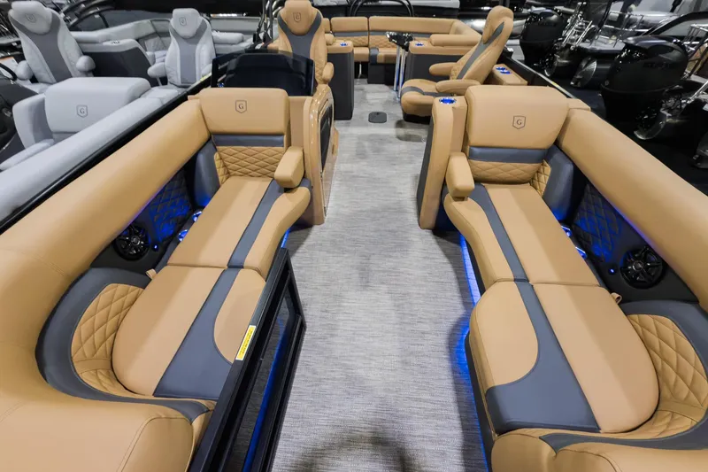 Slide: The Image of Luxurious interior of 2026 Godfrey Monaco 235 Ultra Lounge pontoon boat with tan seating. - 4