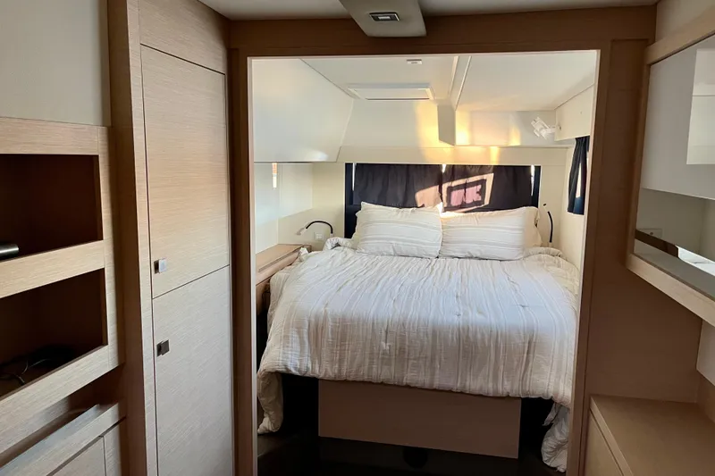 Slide: The Image of Luxurious bedroom interior of 2018 Fountaine Pajot Saona catamaran with cozy bedding. - 17