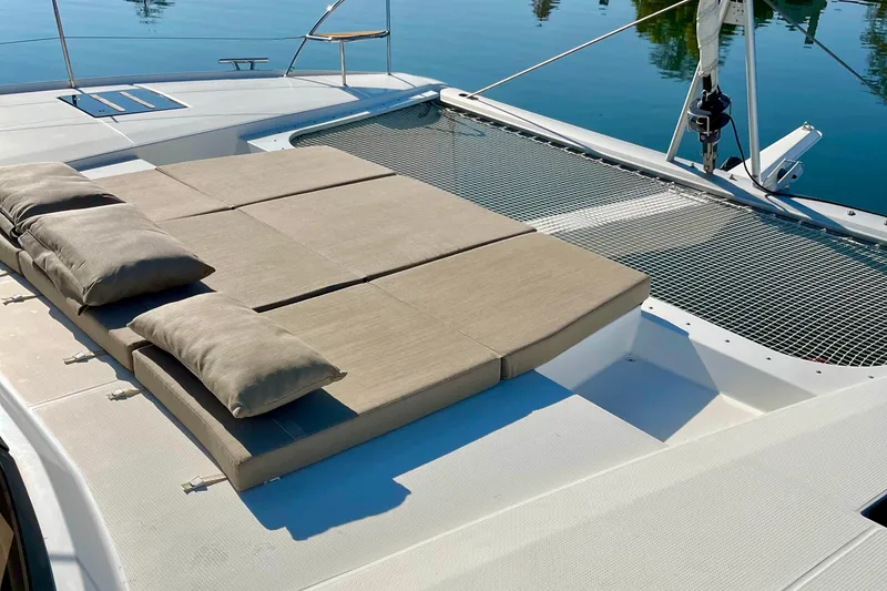 Slide: The Image of Luxurious 2018 Fountaine Pajot Saona catamaran with sunbathing cushions and netting on deck. - 7