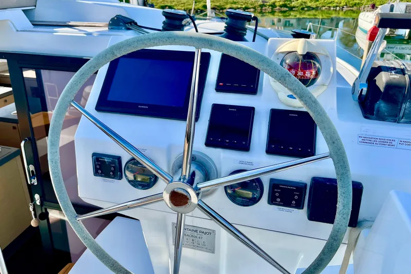 Slide: The Image of Helm of 2018 Fountaine Pajot Saona catamaran with navigation instruments and compass. - 4