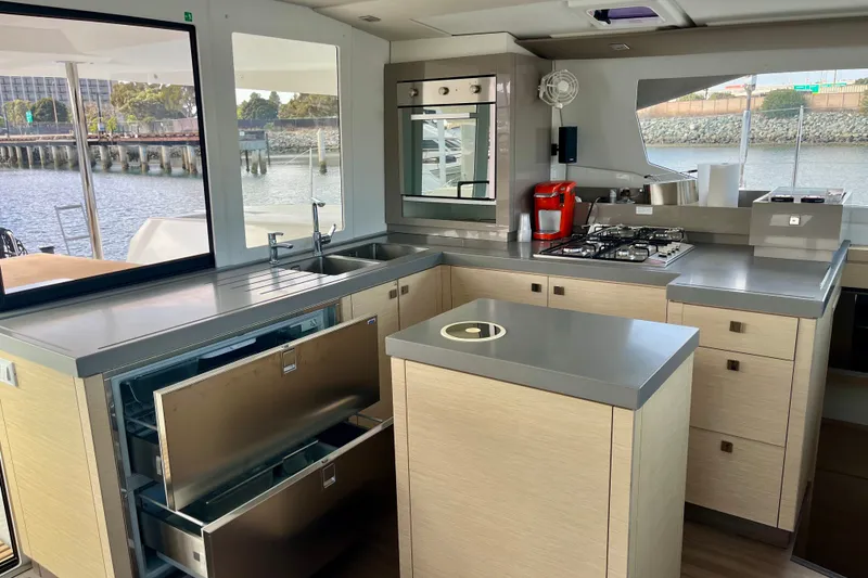 Slide: The Image of Modern kitchen interior of 2018 Fountaine Pajot Saona 47 catamaran with sleek appliances and ample counter space. - 15
