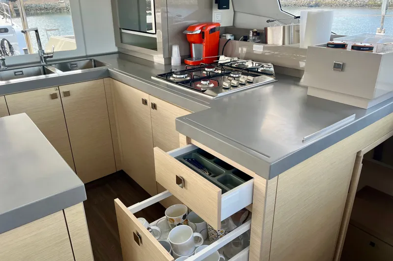 Slide: The Image of Modern kitchen interior of 2018 Fountaine Pajot Saona 47 catamaran with sleek countertops and appliances. - 14