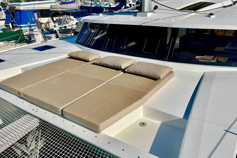 Slide: The Image of 2018 Fountaine Pajot Saona catamaran with sunbathing cushions on deck. - 6