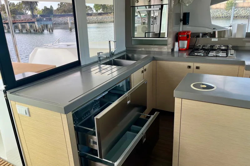 Slide: The Image of Modern kitchen interior of 2018 Fountaine Pajot Saona 47 catamaran with sleek cabinetry and appliances. - 17