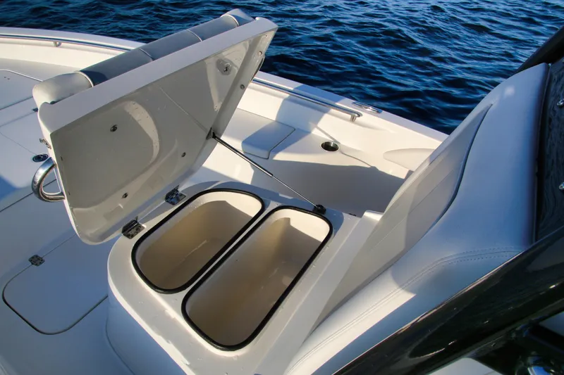 Slide: The Image of 2023 ShearWater 260 SS Carolina boat with open storage compartment on deck. - 12