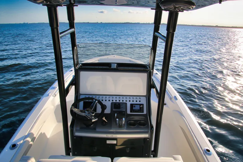 Slide: The Image of 2023 ShearWater 260 SS Carolina boat dashboard on open water. - 14