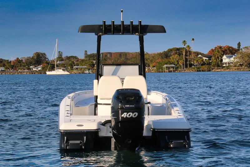 Slide: The Image of 2023 ShearWater 260 SS Carolina boat on calm water, rear view with powerful engine. - 6