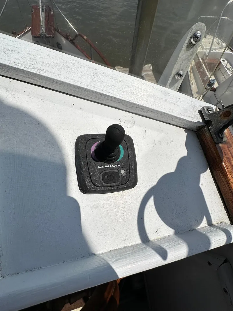 Slide: The Image of Joystick control on a 1974 Grand Banks 32 Sedan boat dashboard. - 14