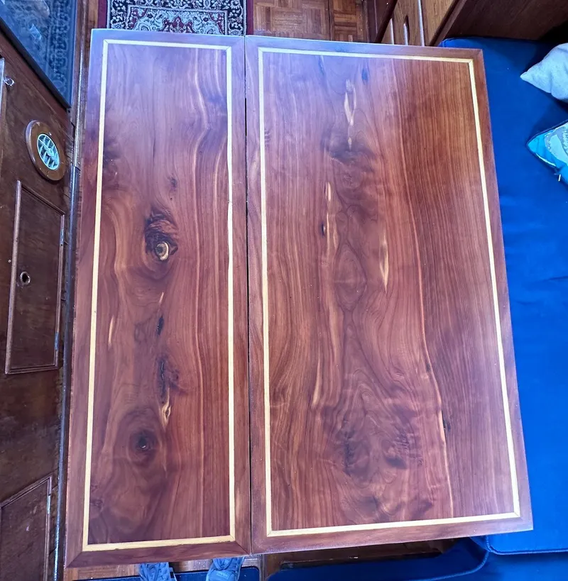 Slide: The Image of Wooden table on a 1974 Grand Banks 32 Sedan boat interior. - 19