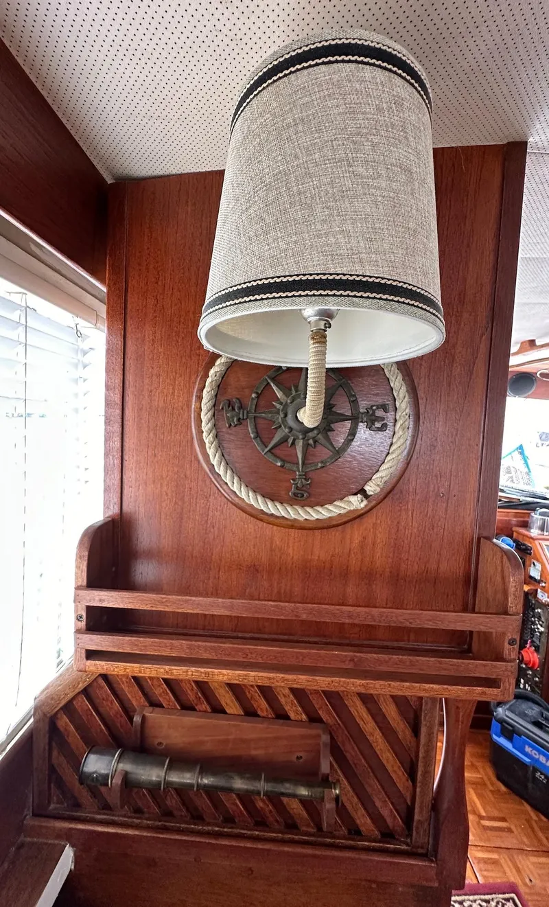 Slide: The Image of 1974 Grand Banks 32 Sedan interior with nautical decor and wooden accents. - 20