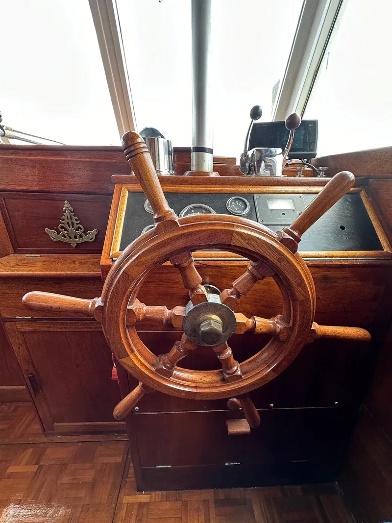 Slide: The Image of Wooden helm of a 1974 Grand Banks 32 Sedan boat. - 42