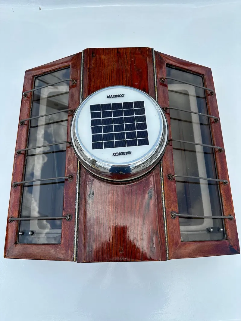 Slide: The Image of 1974 Grand Banks 32 Sedan wooden hatch with solar-powered marine light. - 5