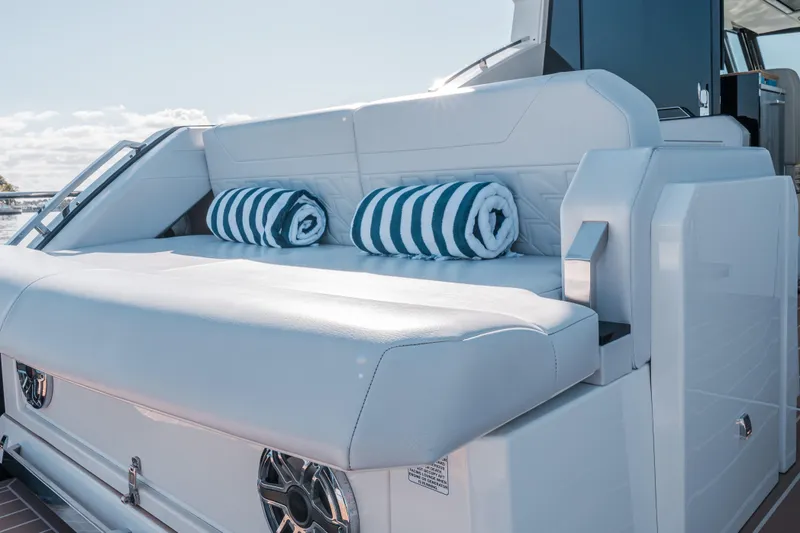 Slide: The Image of Luxurious seating on 2022 Formula 500 Super Sport Crossover yacht with striped towels. - 18