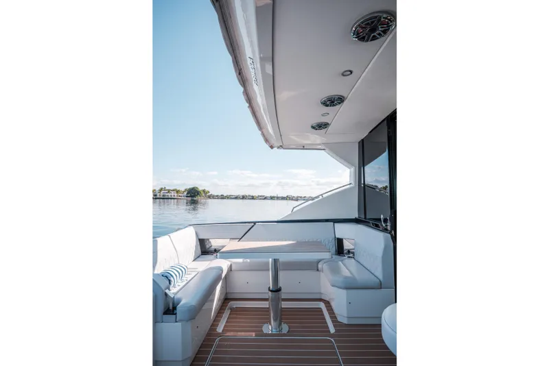 Slide: The Image of Luxurious 2022 Formula 500 Super Sport Crossover yacht interior with elegant seating and scenic water view. - 19