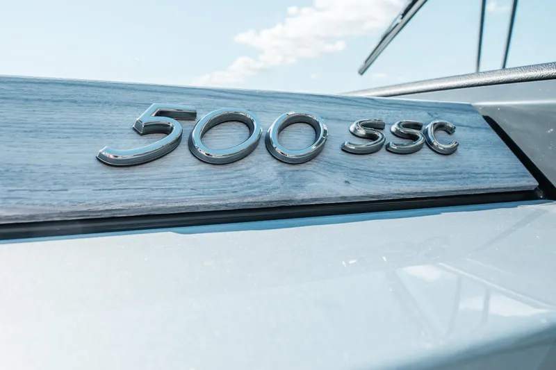 Slide: The Image of 2022 Formula 500 Super Sport Crossover emblem on sleek surface. - 23