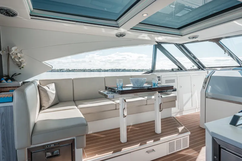 Slide: The Image of Luxurious interior of 2022 Formula 500 Super Sport Crossover yacht with elegant seating and dining area. - 26