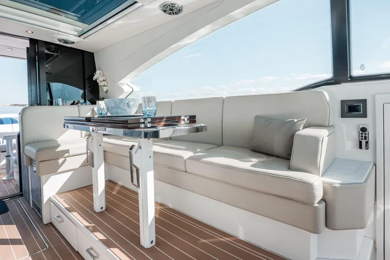 Slide: The Image of Luxurious interior of 2022 Formula 500 Super Sport Crossover yacht with elegant seating and table. - 27