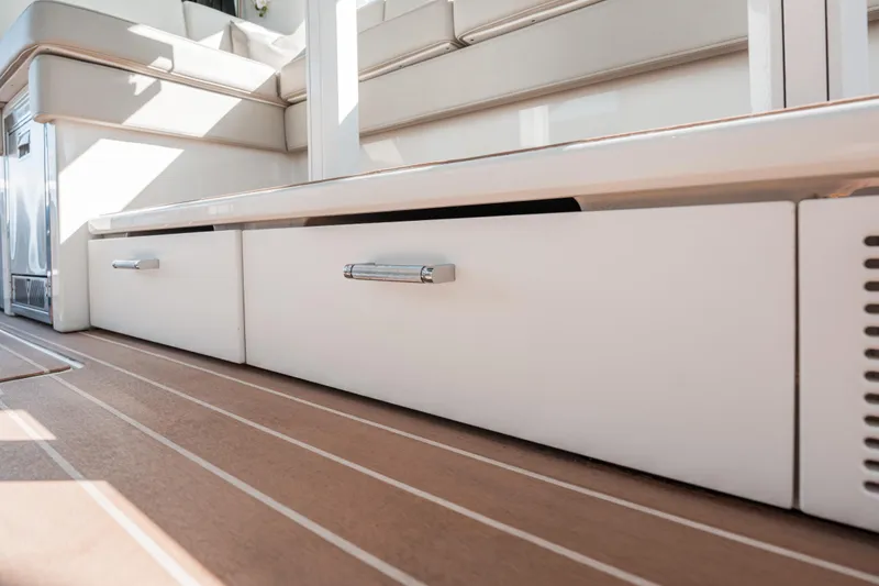 Slide: The Image of 2022 Formula 500 Super Sport Crossover interior with sleek white cabinetry and wood flooring. - 28
