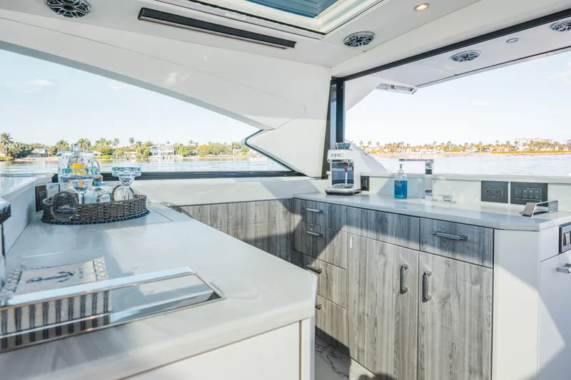 Slide: The Image of Luxurious interior of 2022 Formula 500 Super Sport Crossover yacht with modern kitchen amenities. - 30