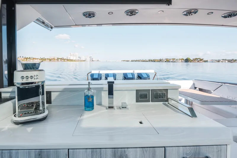 Slide: The Image of Luxury yacht kitchen on 2022 Formula 500 Super Sport Crossover, featuring coffee maker and ocean view. - 31