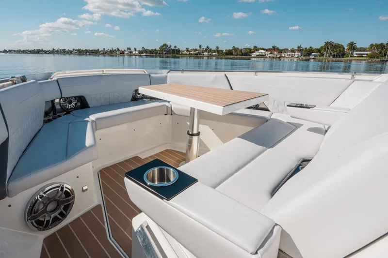 Slide: The Image of 2022 Formula 500 Super Sport Crossover boat interior with luxurious seating and table. - 35