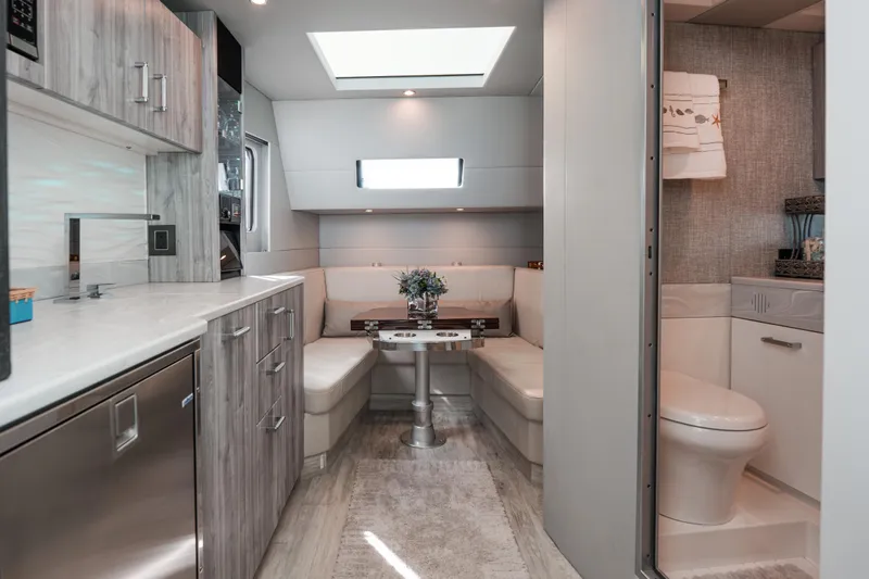 Slide: The Image of Luxurious interior of 2022 Formula 500 Super Sport Crossover yacht with modern kitchen and seating area. - 36