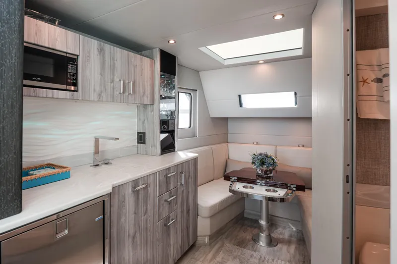 Slide: The Image of Luxurious interior of 2022 Formula 500 Super Sport Crossover with modern kitchen and cozy seating area. - 37