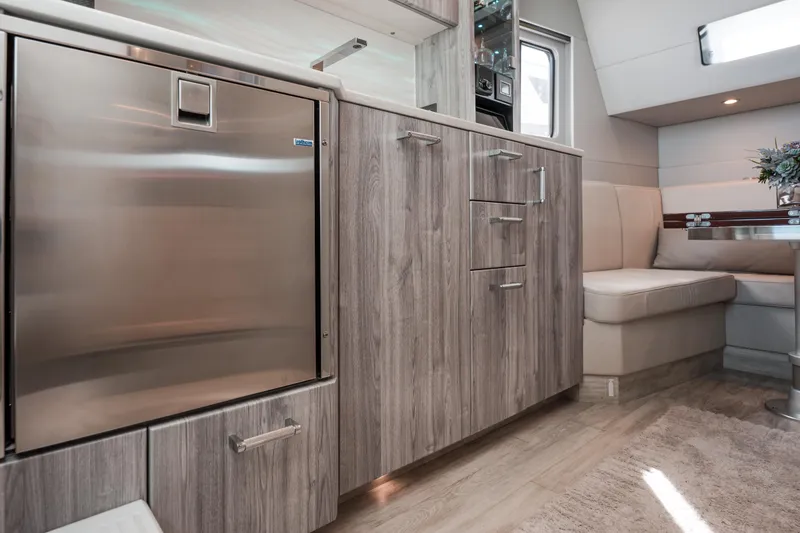 Slide: The Image of Luxurious interior of 2022 Formula 500 Super Sport Crossover with modern kitchen and seating area. - 38