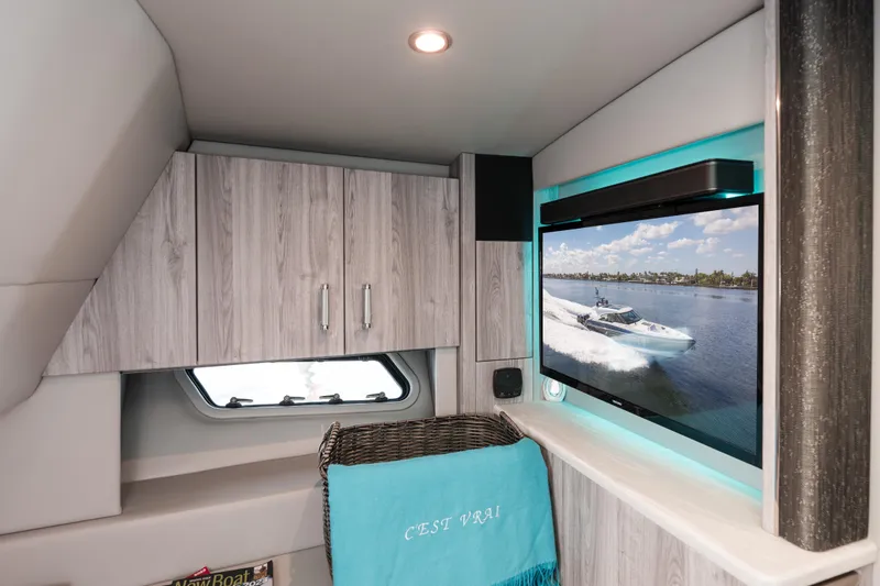 Slide: The Image of Interior of 2022 Formula 500 Super Sport Crossover with modern cabinetry and TV display. - 40