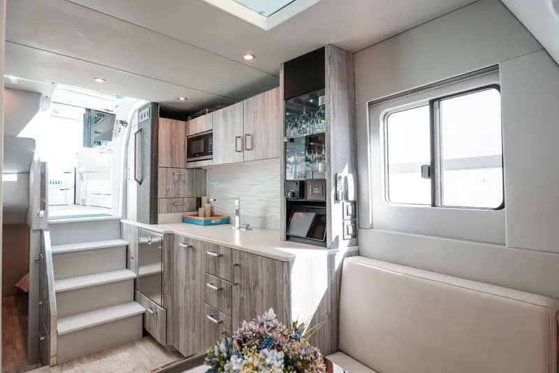 Slide: The Image of Luxurious interior of 2022 Formula 500 Super Sport Crossover yacht with modern kitchen and seating. - 41