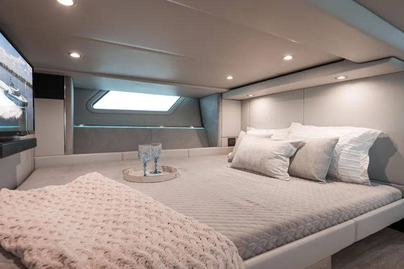 Slide: The Image of Luxurious cabin interior of 2022 Formula 500 Super Sport Crossover yacht, featuring cozy bedding. - 44