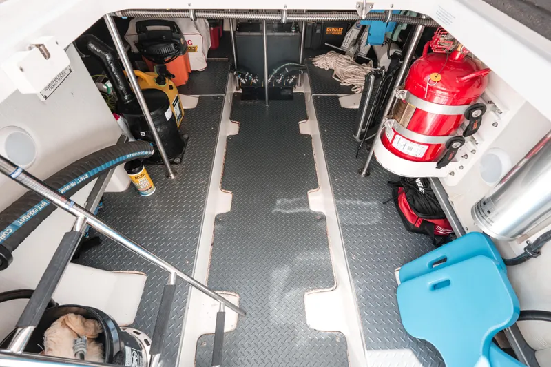 Slide: The Image of 2022 Formula 500 Super Sport Crossover engine room with equipment and storage. - 45
