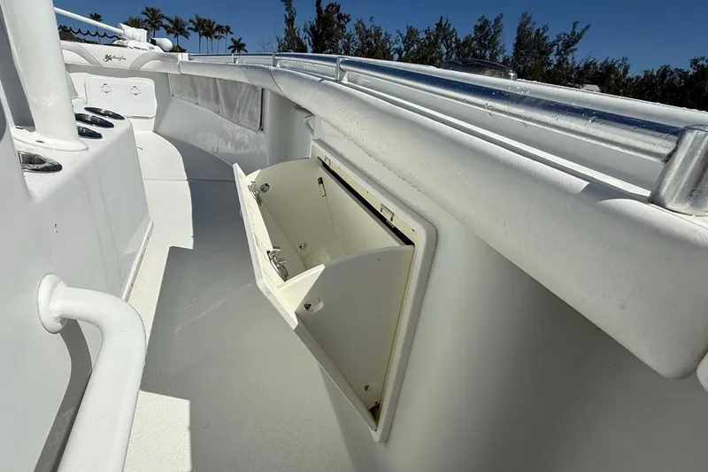 Slide: The Image of 2017 Yellowfin 26 Hybrid boat interior with open storage compartment. - 16