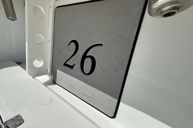 Slide: The Image of Close-up of 2017 Yellowfin 26 Hybrid boat interior with number 26 displayed. - 20