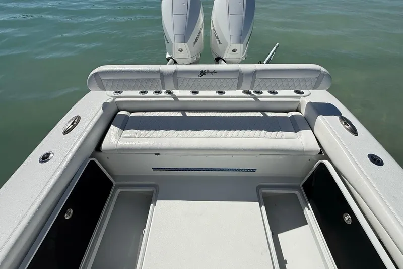 Slide: The Image of 2017 Yellowfin 26 Hybrid boat interior with seating and dual Mercury engines. - 26