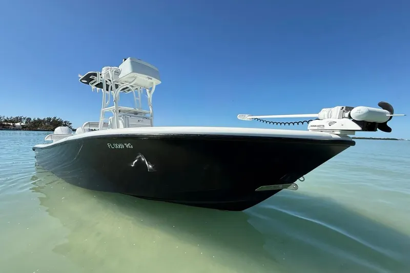 Slide: The Image of 2017 Yellowfin 26 Hybrid boat on clear water under blue sky. - 3