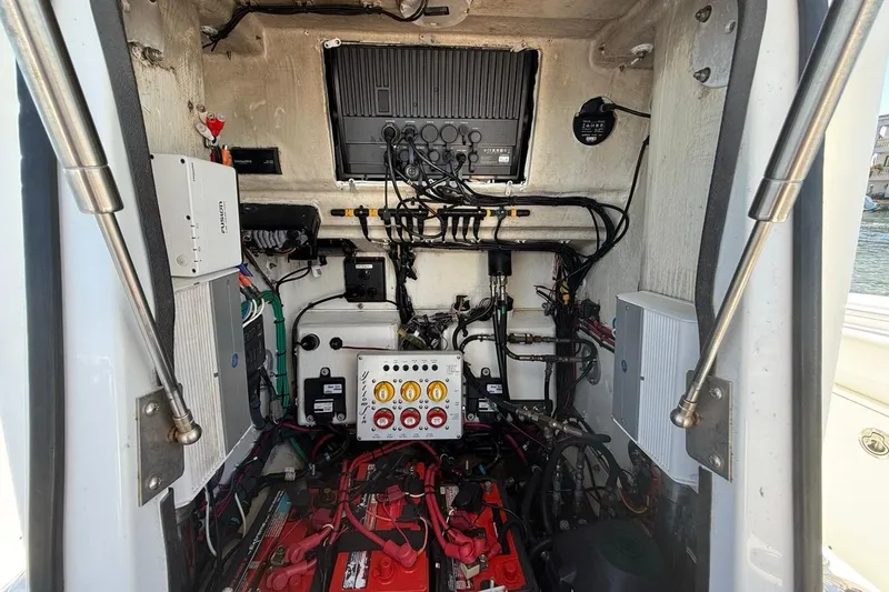 Slide: The Image of 2017 Yellowfin 26 Hybrid boat electrical system with wiring and control panels. - 9