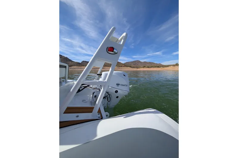 Slide: The Image of Tide Craft Beaver 10 boat on water, 2026 model, with Tohatsu motor, scenic lake view. - 11