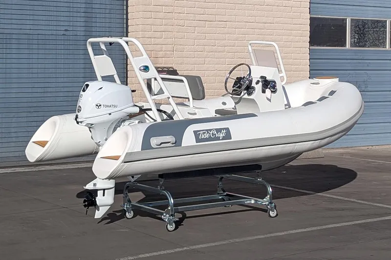 Slide: The Image of Manufacturer Provided Image: 2025 Tide Craft Beaver 10 inflatable boat with Tohatsu engine on display. - 6
