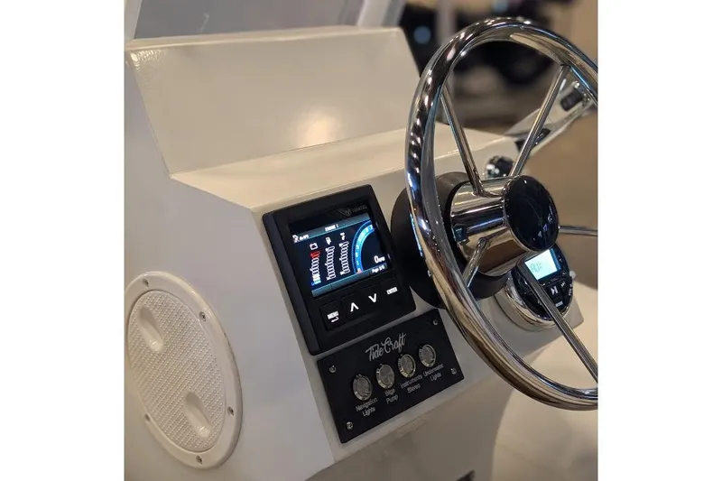 Slide: The Image of Manufacturer Provided Image: Steering console of 2025 Tide Craft Beaver 10 boat with modern controls and display. - 8