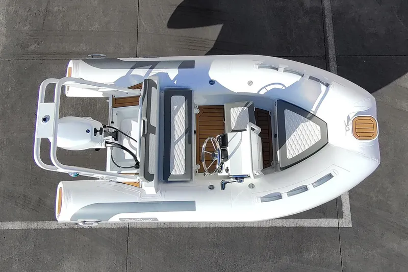 Slide: The Image of Manufacturer Provided Image: Overhead view of 2025 Tide Craft Beaver 10 inflatable boat on concrete surface. - 9