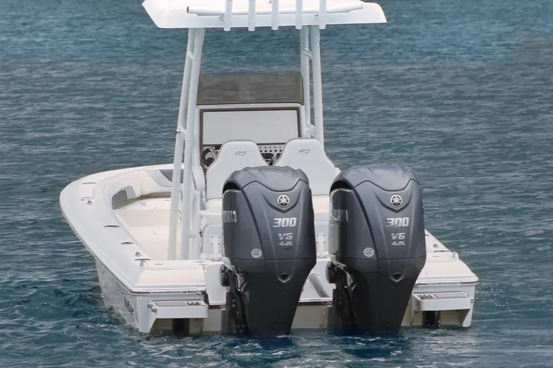 Slide: The Image of 2024 ShearWater 270 SS Open Carolina boat with twin Yamaha 300 engines on water. - 11