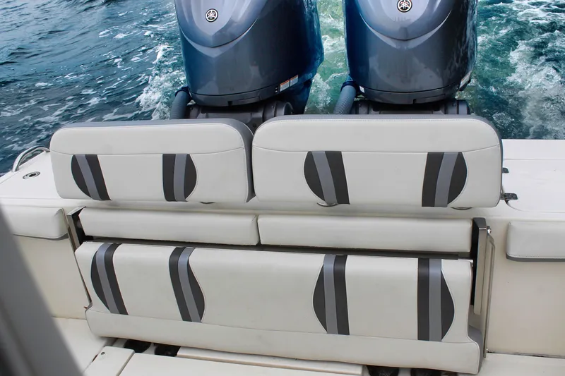 Slide: The Image of 2024 ShearWater 270 SS Open Carolina boat with dual engines and cushioned seating. - 15