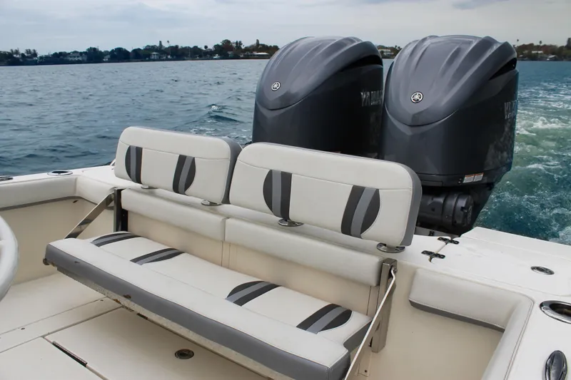 Slide: The Image of 2024 ShearWater 270 SS Open Carolina boat with dual engines and seating. - 16