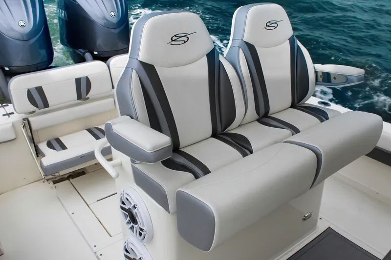 Slide: The Image of 2024 ShearWater 270 SS Open Carolina boat interior with luxury seating and dual engines. - 18